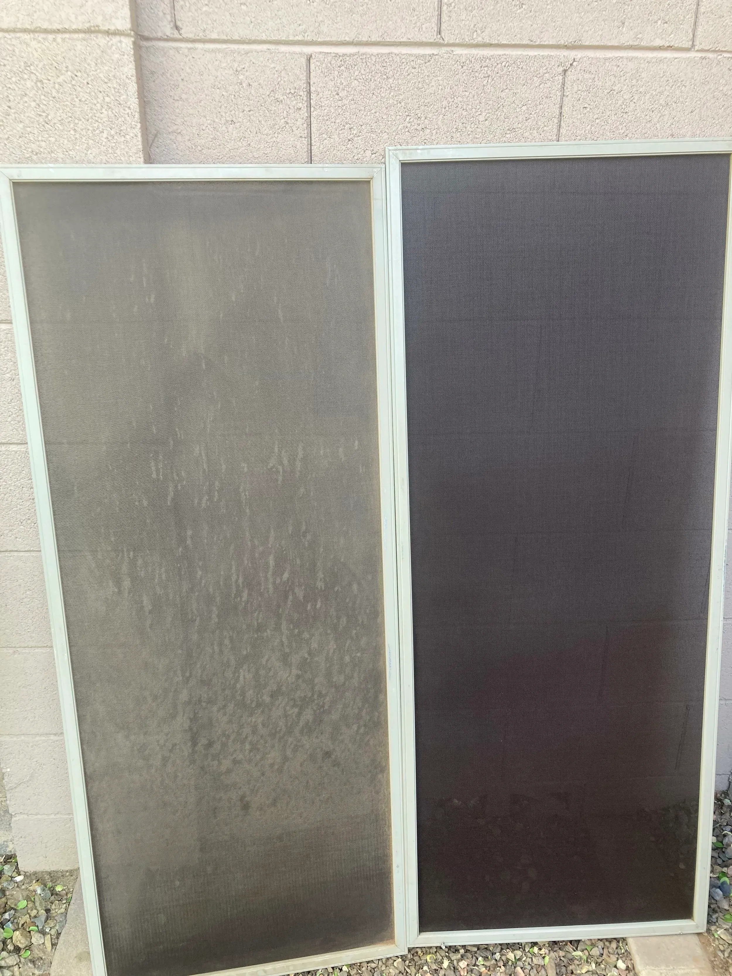 Two sun screens side by side, one caked in dust and one cleaned