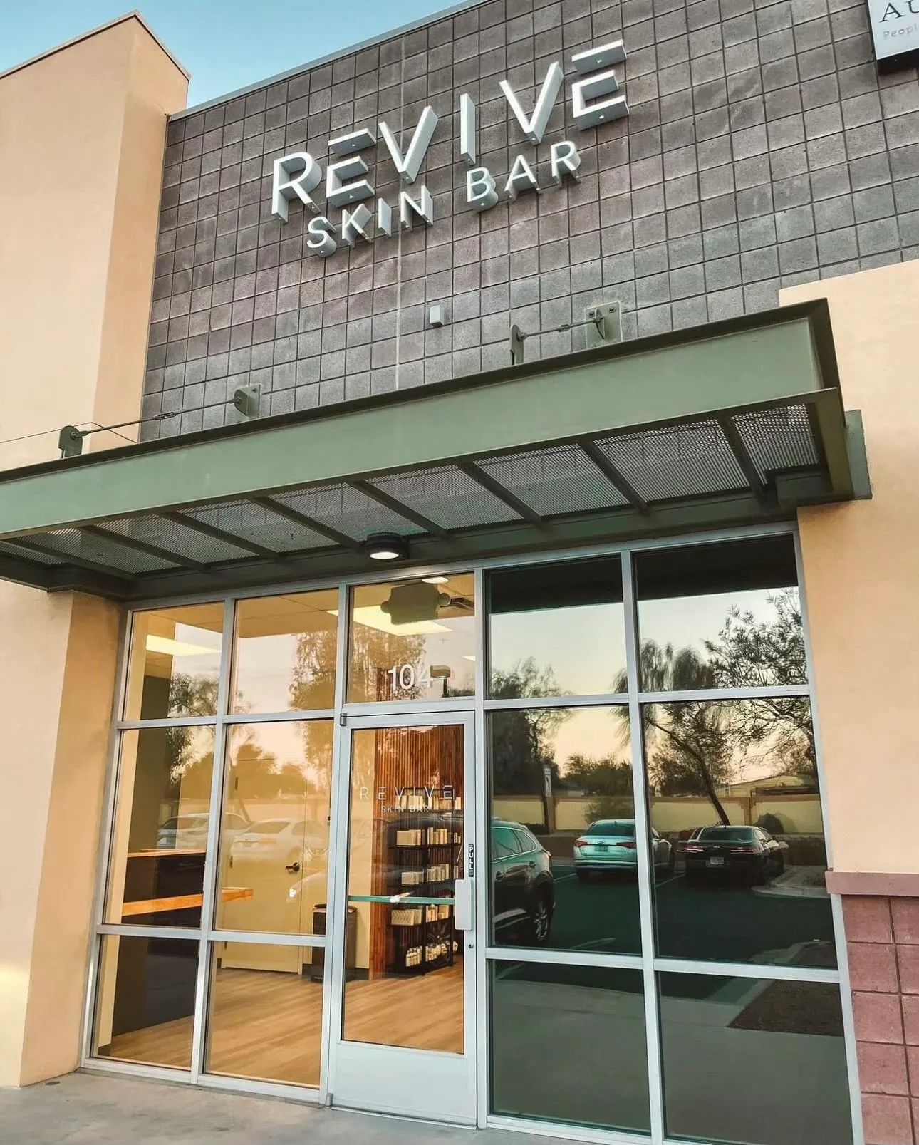 A commercial storefront with freshly cleaned floor-to-ceiling glass